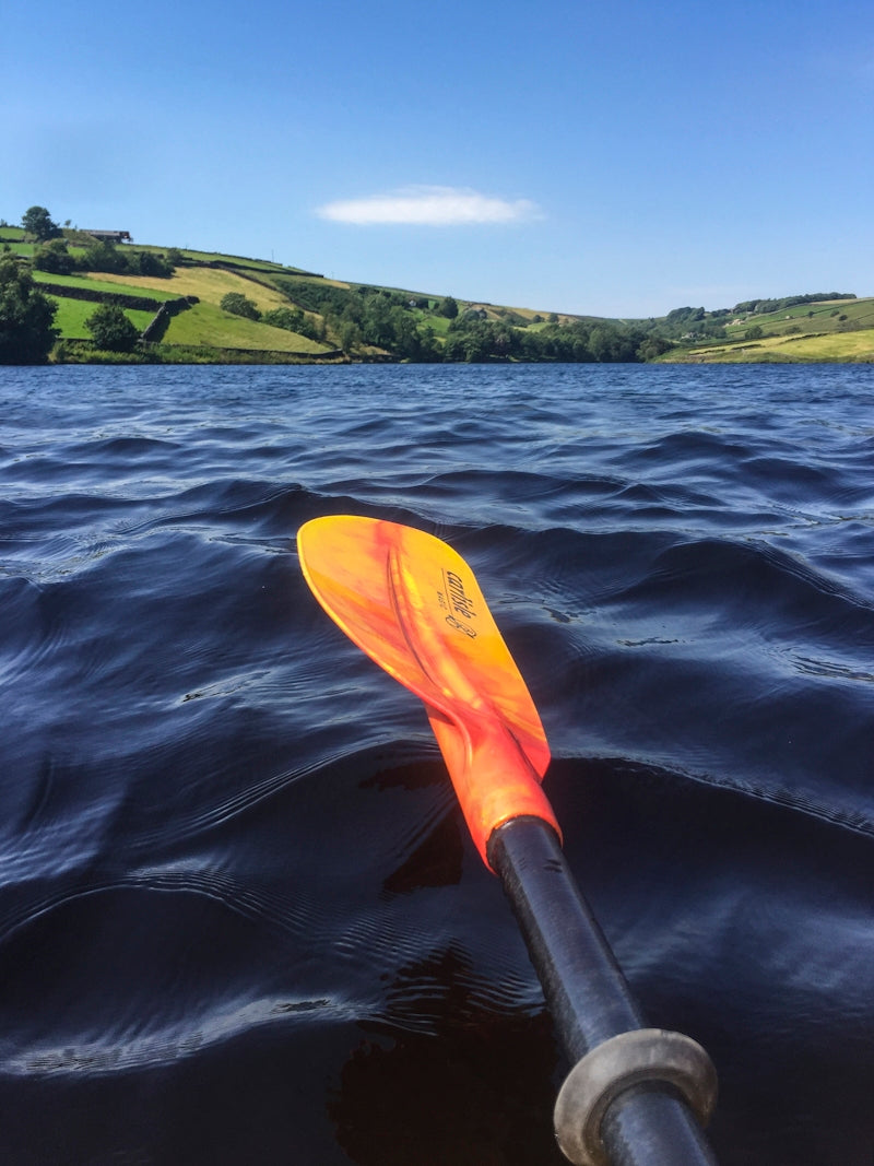 yellow and black kayak on blue sea water during daytime