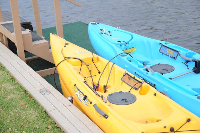 yellow and blue kayak on body of water during daytime